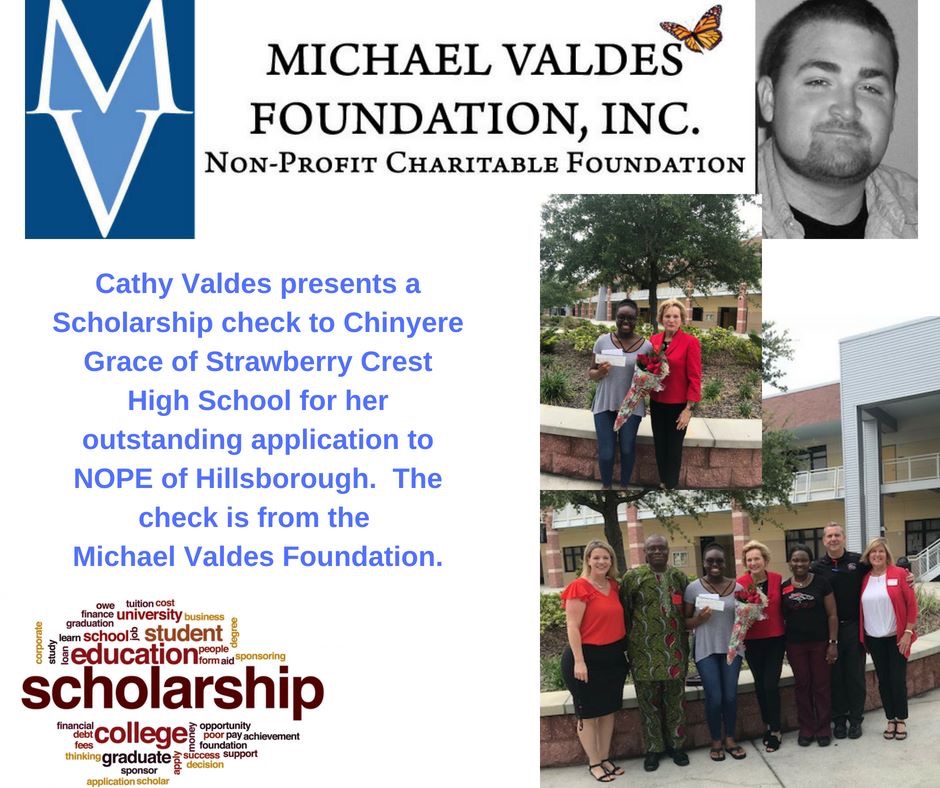 Cathy Valdes presents a scholarship check to Chinyere Grace of Strawberry Crest High School